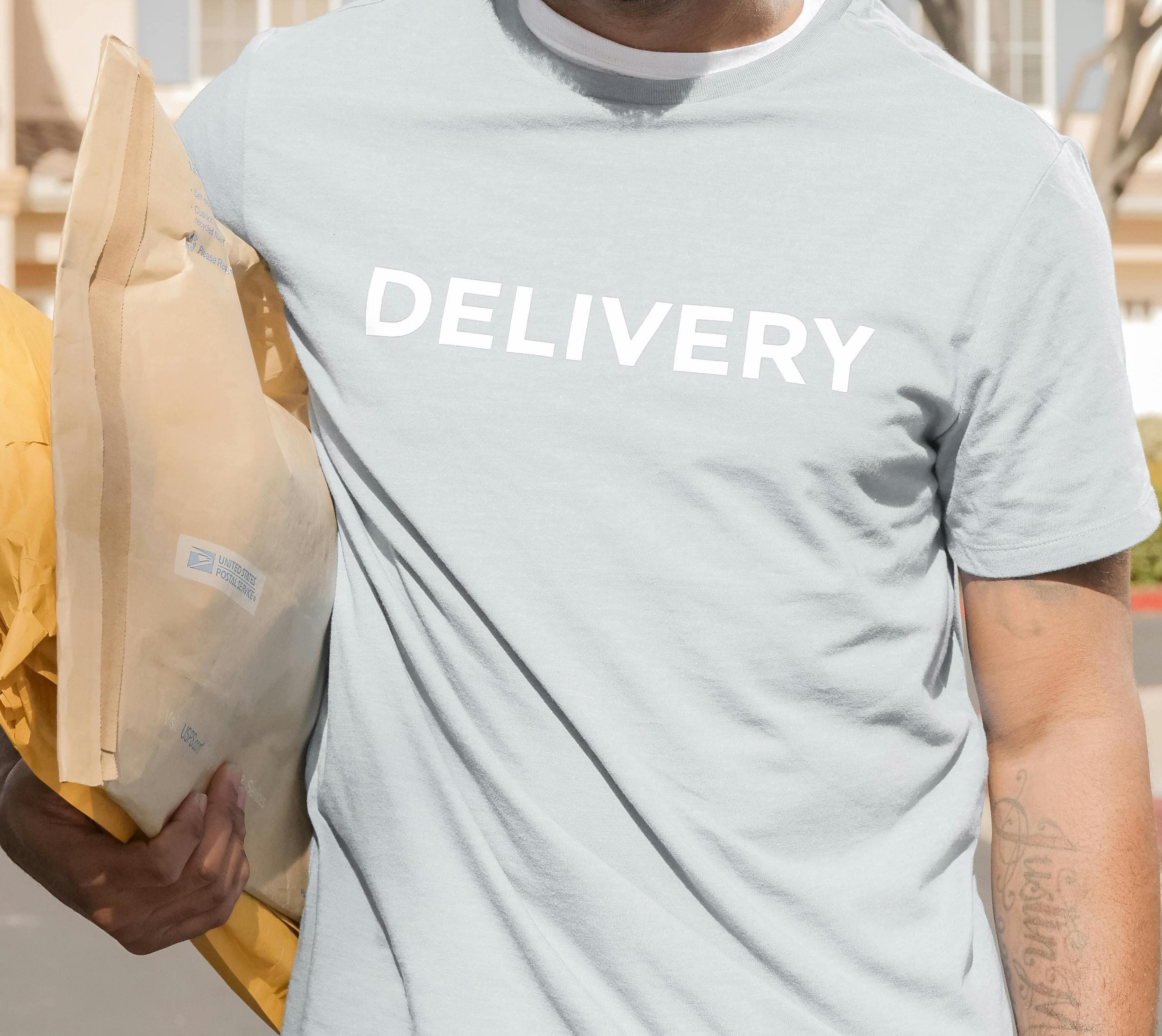 Courier carrying packages for neighborhood delivery
